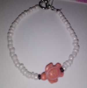 White Beaded Bracelet with Coral Orange Turtle